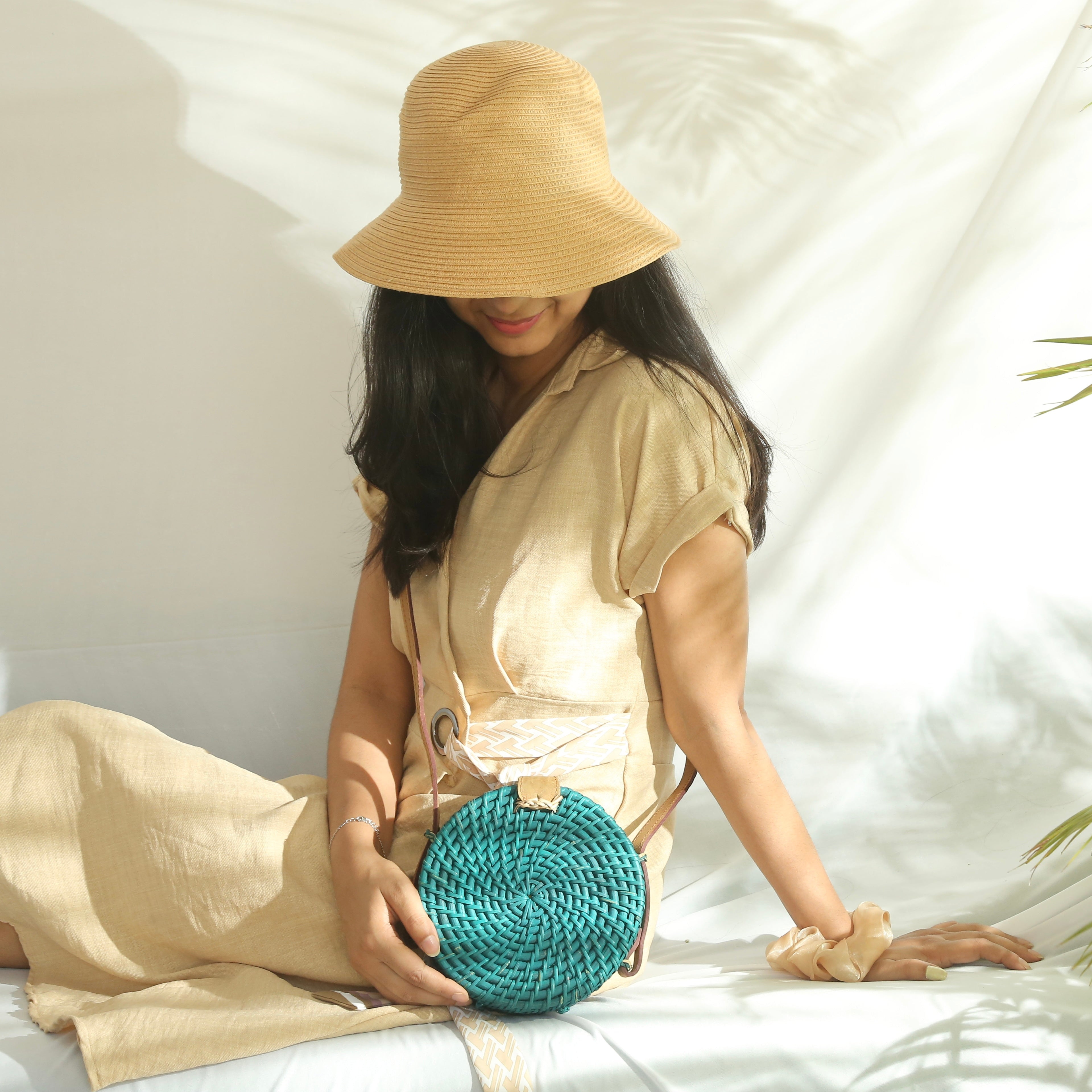 TURQUOISE CANE SLING BAG