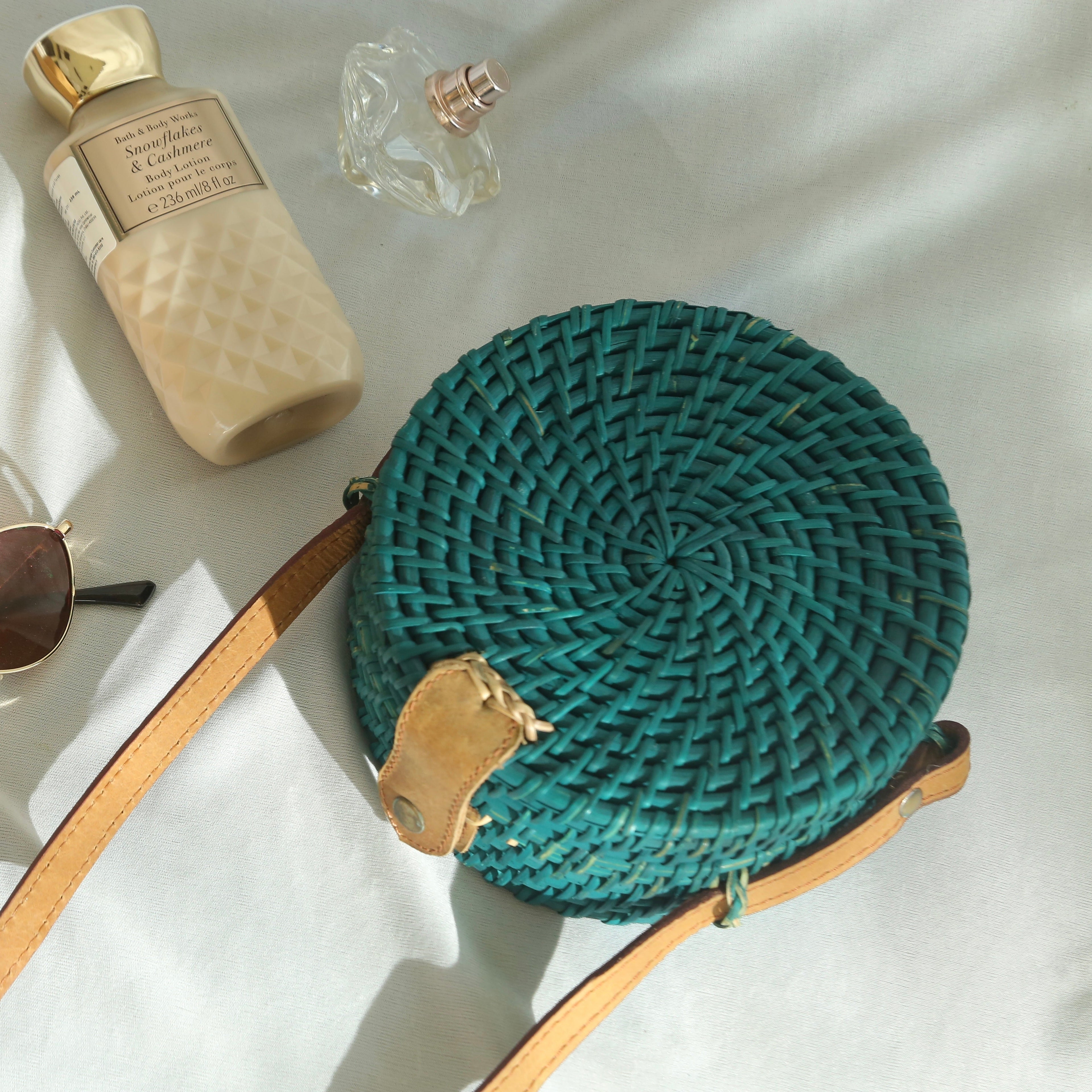TURQUOISE CANE SLING BAG